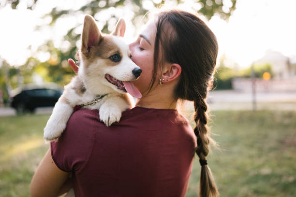 A woman holding a dog